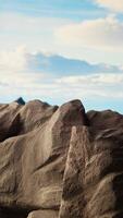 Vertical Panoramic view of a stunning mountain range with rocky terrain in the foreground. Perfect for adventure seekers looking for an extreme hiking experience in the heart of untouched wilderness. video