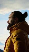 Vertical Hiker embraces the challenge of trekking through the wilderness, enjoys panoramic mountain landscape as a reminder of strength and the rewards of outdoor adventure. Adventure seeker. Camera B. video