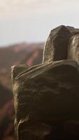 Vertical Remote mountain wilderness with rocky cliffs and sweeping vistas, offering a perfect escape into nature. The fresh air and scenic background create an ideal environment for adventure. video