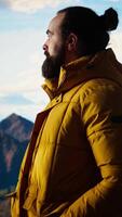 Vertical Traveler takes in the breathtaking mountain landscape and beautiful peaks, high altitude view with fresh air and panoramic sky creates a peaceful setting for relaxation. Self improvement. Camera A. video