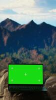 Vertical Dramatic mountain range stretches across the horizon with green screen, offering a spectacular scenic view for hikers and adventurers. The rugged terrain is a challenge worth conquering. video