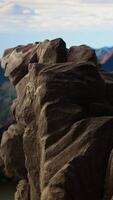 Vertical Remote mountain wilderness with rocky cliffs and sweeping vistas, offering a perfect escape into nature. The fresh air and scenic background create an ideal environment for adventure. video