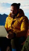 Vertical Frustrated upset entrepreneur getting tired of work problems on vacation, strong signal and internet everywhere for a person climbing on mountain top. Hiker trying to decompress. Camera A. video