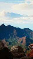 Vertical Clumsy hiker tripping and falling off of a mountain peak cliff, leading to an accident due to lack of attention. Inconsiderate unprepared traveler stumbles on unstable terrain. Camera A. video