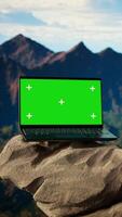 Vertical Dramatic mountain range stretches across the horizon with green screen, offering a spectacular scenic view for hikers and adventurers. The rugged terrain is a challenge worth conquering. video