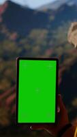 Vertical Climber admires breathtaking mountain peak with copy space screen, joyous stance embodies determination, endurance, and the personal fulfillment that comes with overcoming challenges. Camera B. video