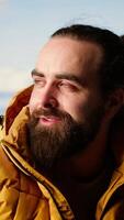 Vertical Trekker climbing to the top of a breathtaking mountain range and soaks in the stunning scenery while he rests. Feeling proud of his personal achievement as a nature lover. Camera B. video