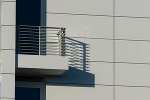 Modern building architecture showcasing shadow patterns on wall photo