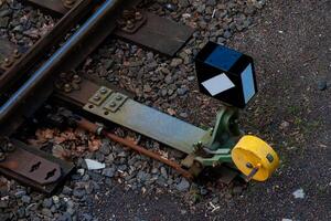 Railway switch mechanism with signal indicator on tracks photo