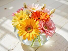 A vase filled with colorful flowers on a table photo