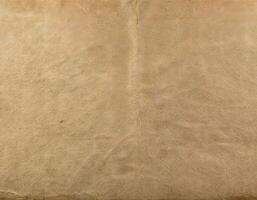 Old Wrinkled Paper with Slightly Torn Borders and Stains photo