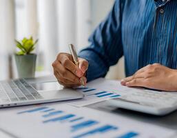Man Accountant Working on Finances and Calculating Costs at Home photo
