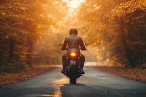 A motorcyclist rides a motorcycle on an asphalt road between the forest. Motorcycle on an empty road. Generated by artificial intelligence. photo