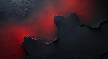 Subtle and evocative abstract backdrop created by red light blending into black on a textured surface photo