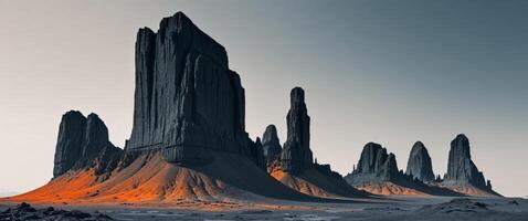 An image of a desert landscape with some tall rock formations photo