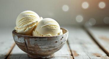 Creamy vanilla ice cream scoops in a rustic wooden bowl on a neutral colored surface background. photo