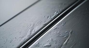 Textured metal surface with shiny silver strip photo