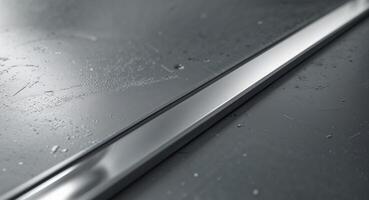Textured metal surface with shiny silver strip. photo