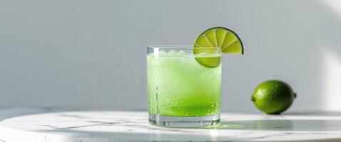 A lime drink with a lime slice on top photo