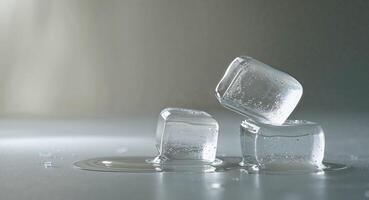 Three ice cubes sitting on top of a table photo