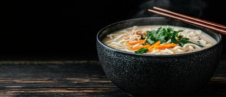 A bowl of delicious ramen soup with chopsticks photo