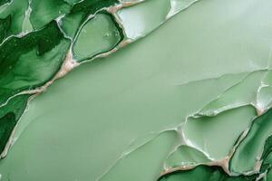 Abstract green paint background with marble effect photo