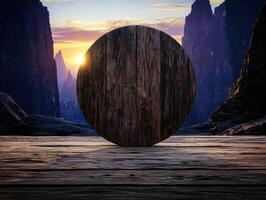 Wooden circle on a wooden table with a mountain landscape background at sunset photo
