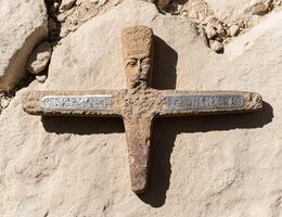 Ancient Egyptian artifact with hieroglyphs on a stone surface photo