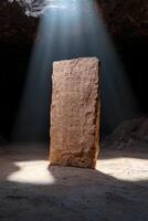Ancient stone tablet with hieroglyphs illuminated in a cave photo