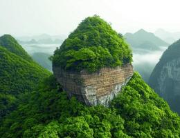 Lush green mountain landscape with unique rock formations photo