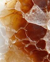 Abstract background of amber and white stones with liquid and bubbles photo
