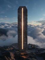 Monolith standing on a rocky mountain peak with clouds in the background photo