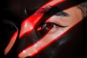 Dramatic portrait of a person with red lighting and shadows photo