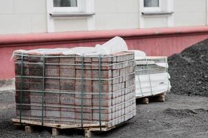 concrete paving slabs stacked on pallet photo