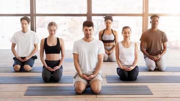Group Meditation. Young People Practicing Breathing Yoga Exercises With Instructor In Modern Studio photo