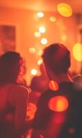 Vibrant social gathering captured with warm lighting and festive bokeh effects creating intimacy photo