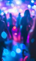 Blurred Crowd Dancing in a Nightclub with Colorful Bokeh Lights Celebration Vibe photo