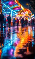 Illuminated Amusement Park Reflecting on Wet Ground with Crowd in the Background photo