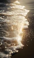 Golden hour waves lapping on the shore creating sparkling patterns and serene mood photo