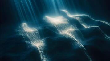 Underwater light rays cascading through ocean water, creating mesmerizing visual effects photo