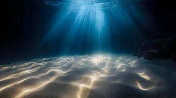 Sunlight Filters Through the Ocean Depths Illuminating the Sandy Seabed Scene photo