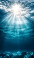 Sunlight Filtering Through the Ocean's Surface Illuminating a Tranquil Underwater Scene photo