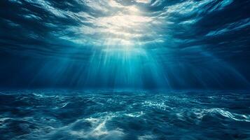 Underwater sunlight beams shining through the sea, creating a serene and mystical atmosphere photo