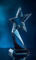 Elegant crystal star trophy against a dark blue background showcasing accomplishment photo