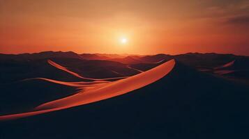 Scenic desert landscape with sun setting on the horizon casting warm light on dunes photo