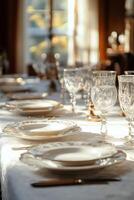 Elegant table setting illuminated by natural light from a nearby window photo