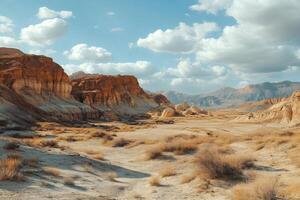 Scenic desert landscape with sandstone formations and sparse vegetation under a cloudy sky photo