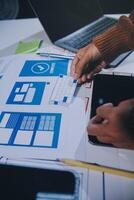 A person is working on a laptop with a blue and white design photo