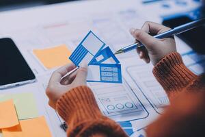A person is working on a project with a blue paper photo