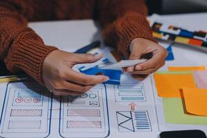 A person is working on a project with a piece of paper photo